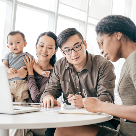 Family filling out paperwork.