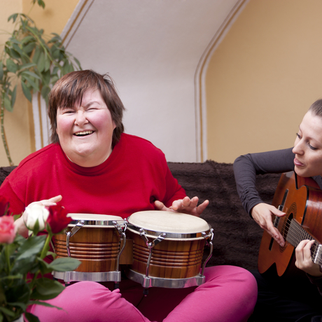 Two women in music therapy.