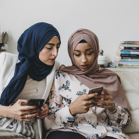 Women looking at their phones. 